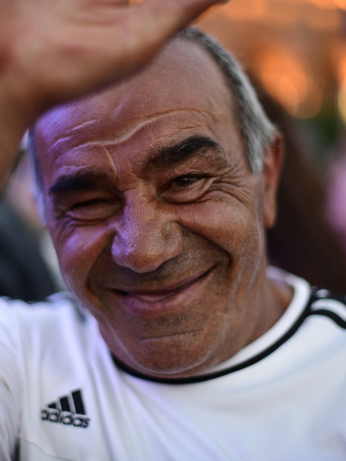 An older man waves and laughs, Yerevan