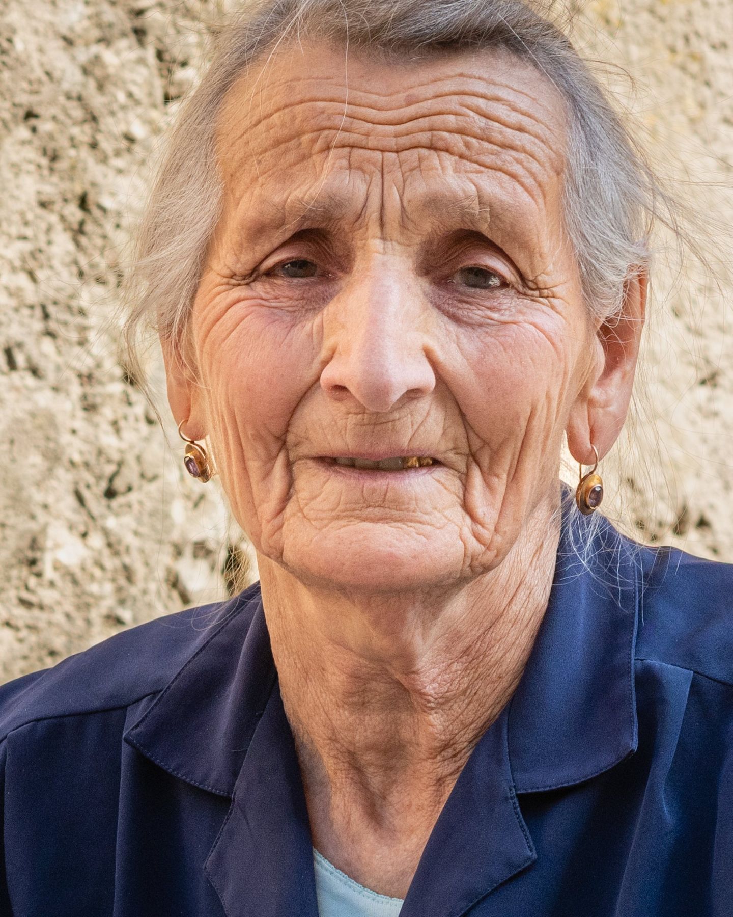 Portrait of an elderly woman in a dark blouse